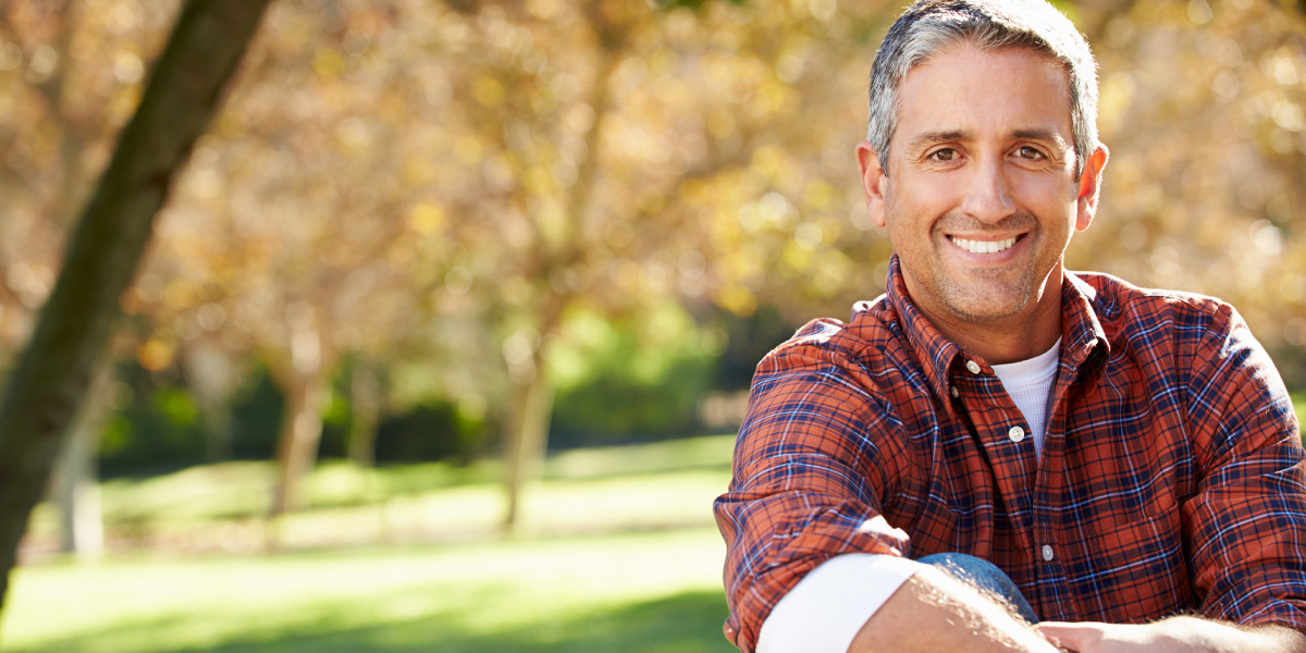 Man sitting outdoors in a park